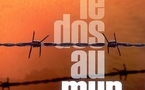 Dos au mur...